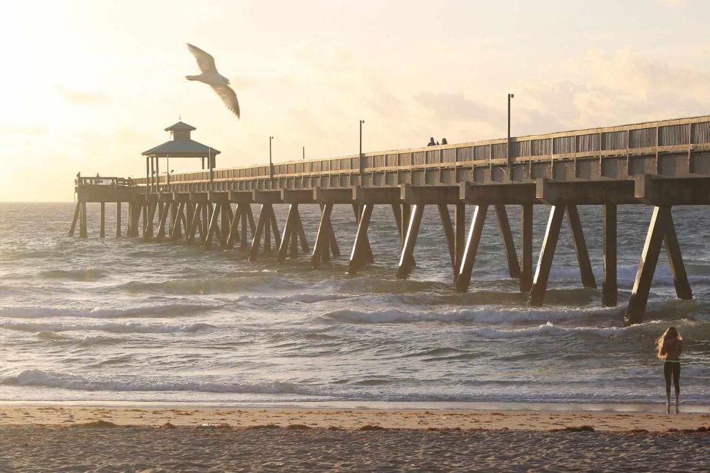 The Deerfield Beach International Fishing Pier reaching into the Atlantic in soft morning light