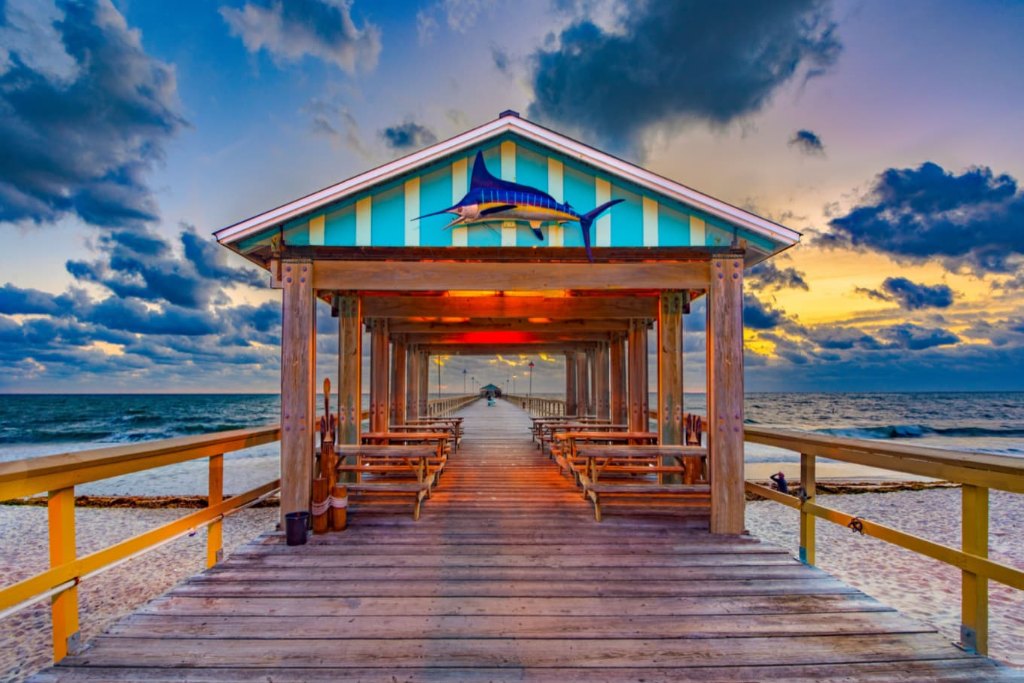 The striped pavilion at the end of Anglin's Pier in Lauderdale-by-the-Sea at sunset
