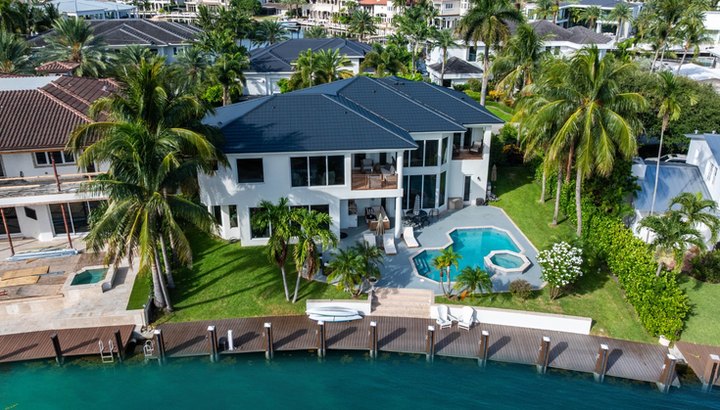 Waterfront residence with pool and dock on the canal